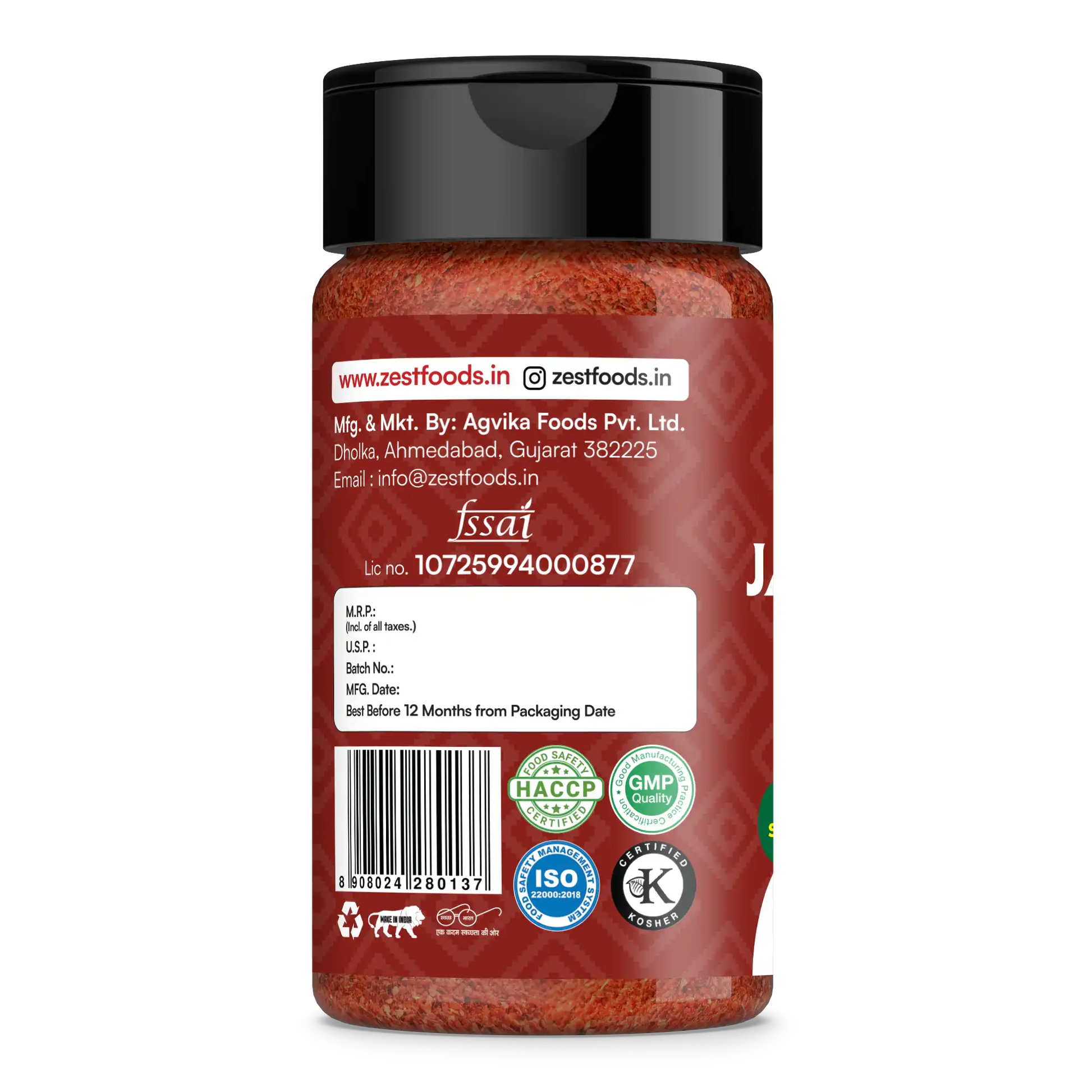 Red spice jar with black lid on a white background