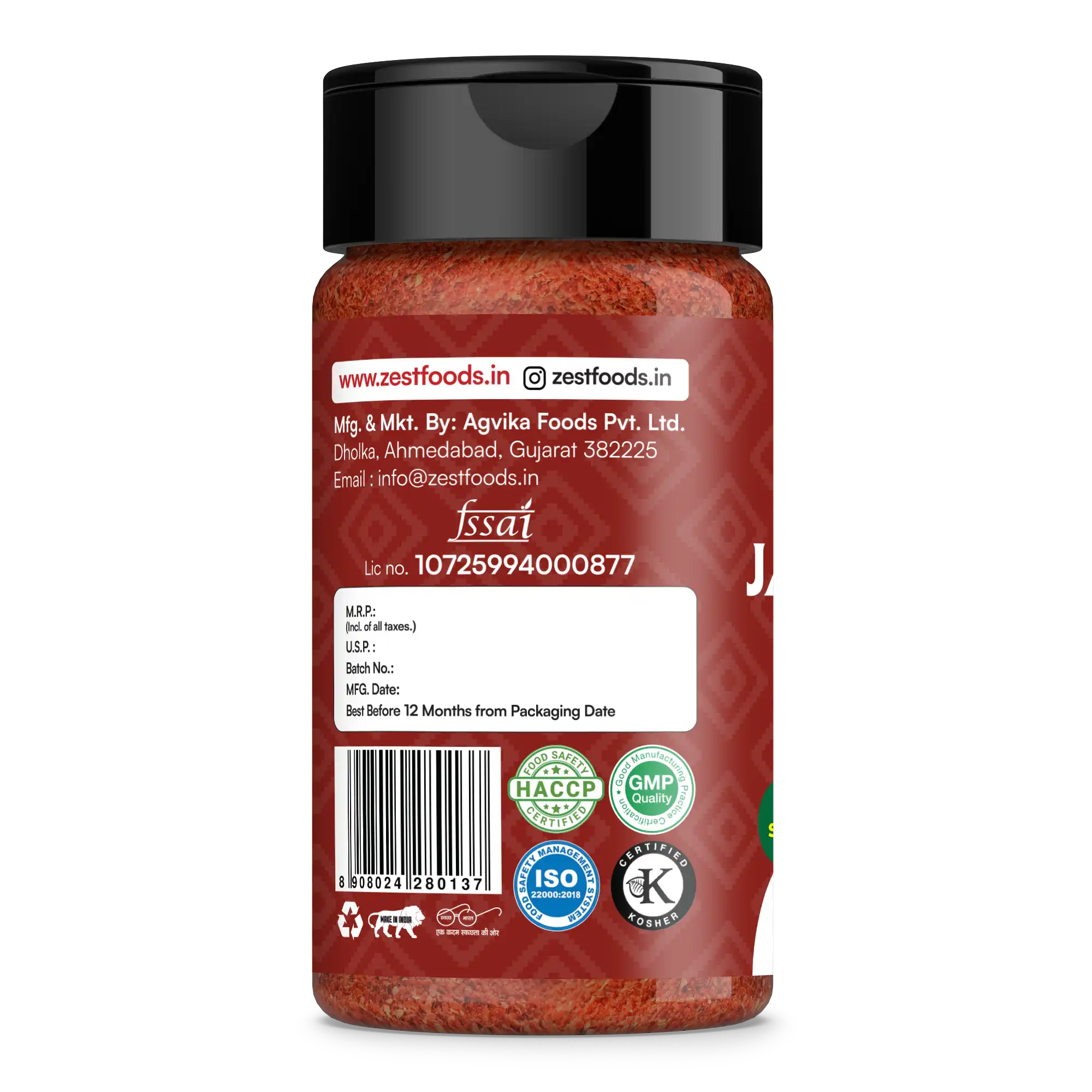 Red spice jar with black lid on a white background